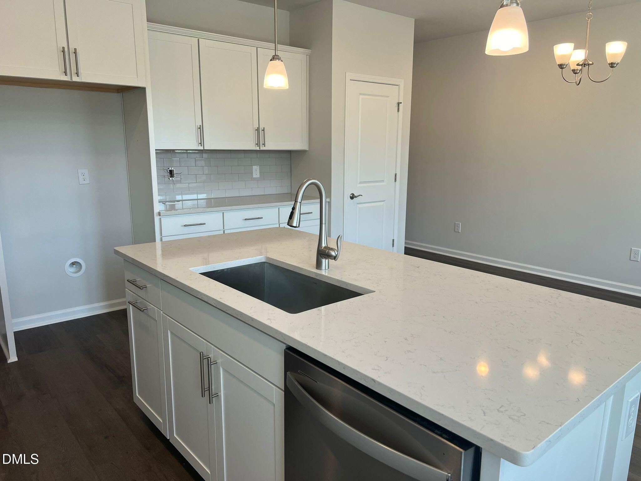 7226 Morris Acres Road Apex, NC 27523 - Photo 13 of 41 a kitchen with a sink and cabinets