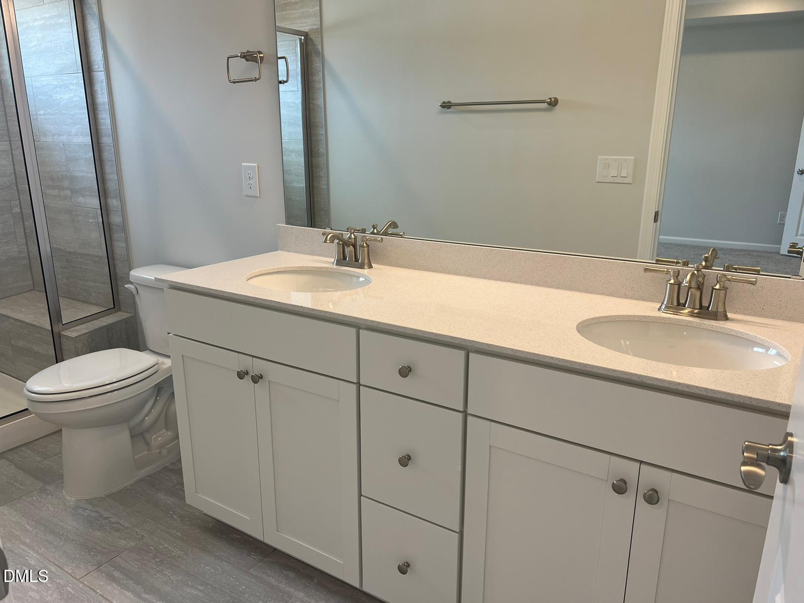 7226 Morris Acres Road Apex, NC 27523 - Photo 25 of 41 a bathroom with a sink toilet and shower
