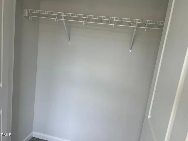 a white toilet sitting next to a bath tub