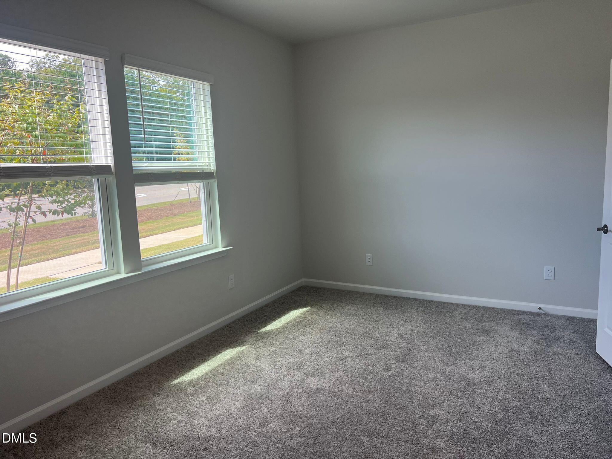 7226 Morris Acres Road Apex, NC 27523 - Photo 3 of 41 an empty room with a window