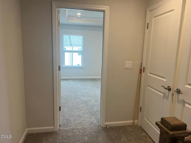 a white toilet sitting next to a shower