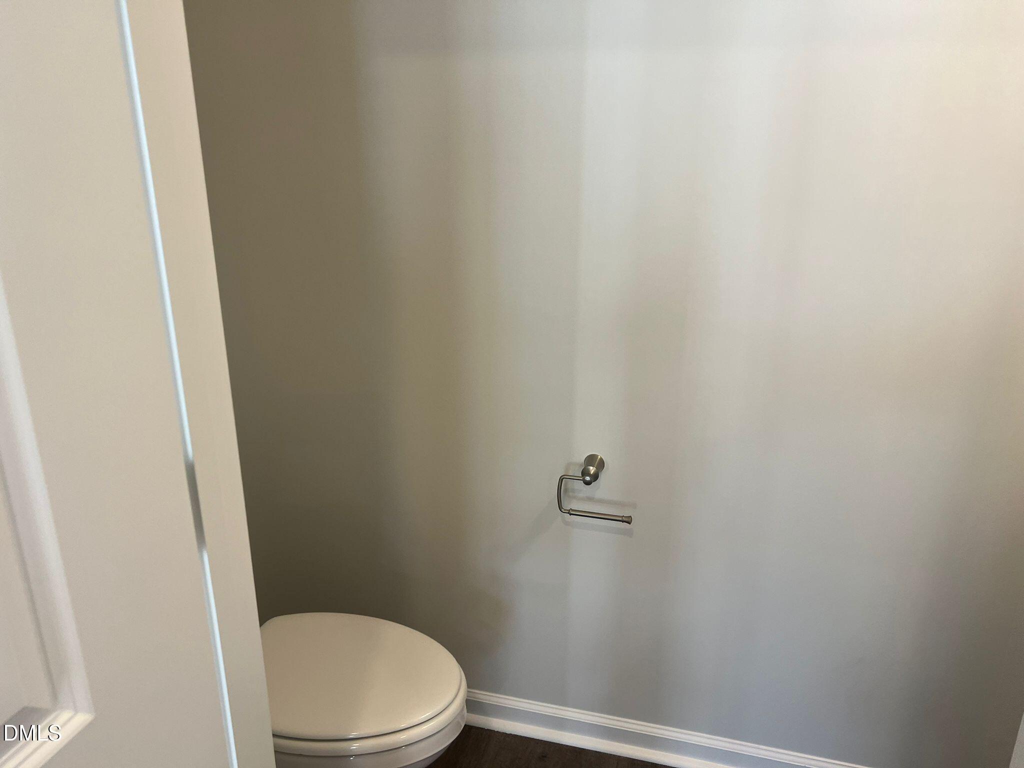 7226 Morris Acres Road Apex, NC 27523 - Photo 36 of 41 a white toilet sitting next to a shower