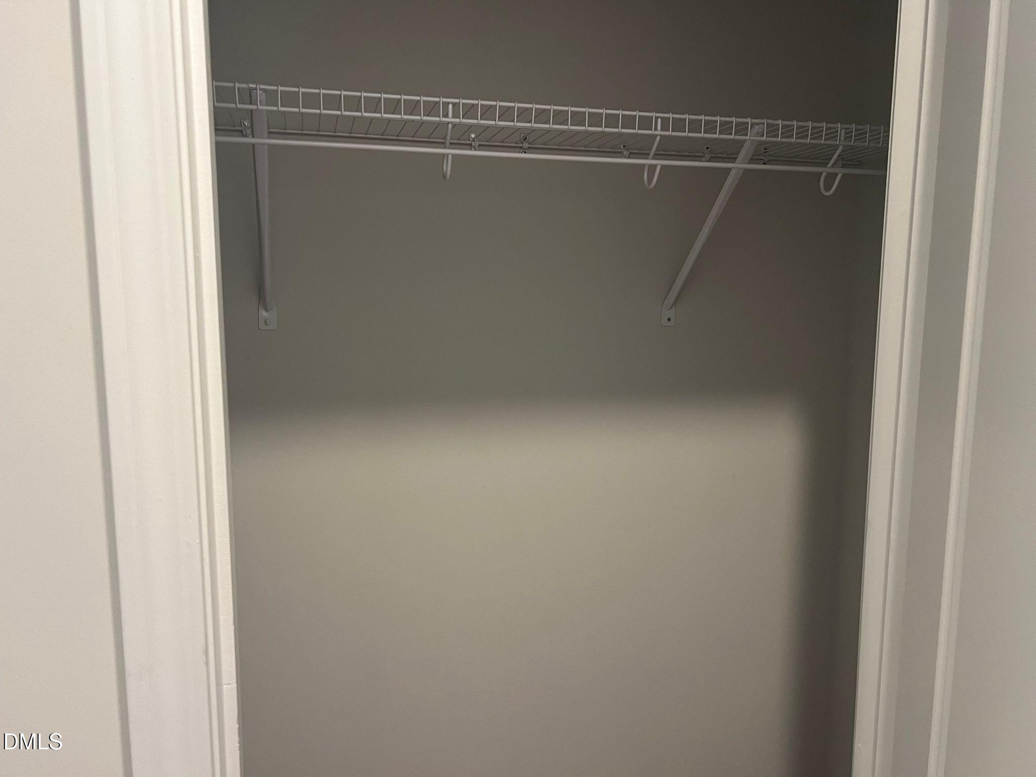 7226 Morris Acres Road Apex, NC 27523 - Photo 4 of 41 a view of a room with racks on the wall