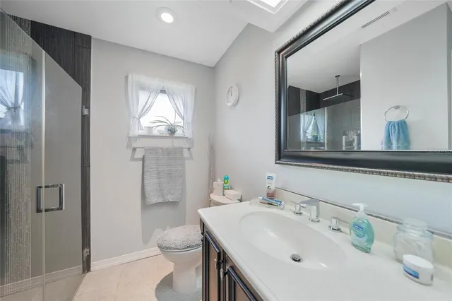 a bedroom with a bed and a table