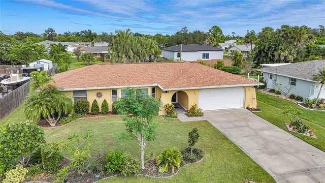 an aerial view of a house with a garden