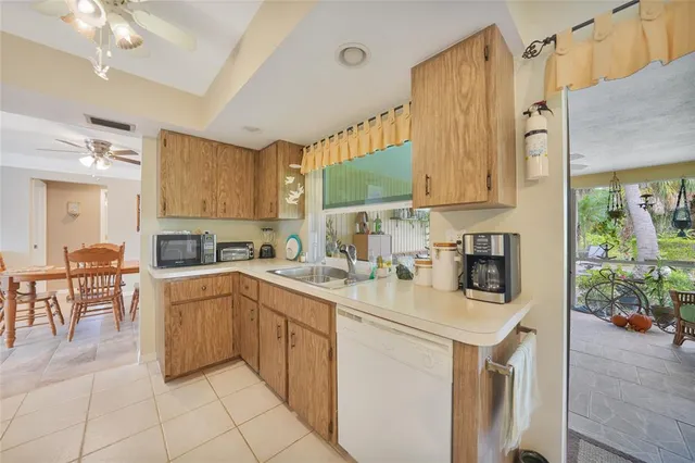 a kitchen with stainless steel appliances a sink stove and cabinets