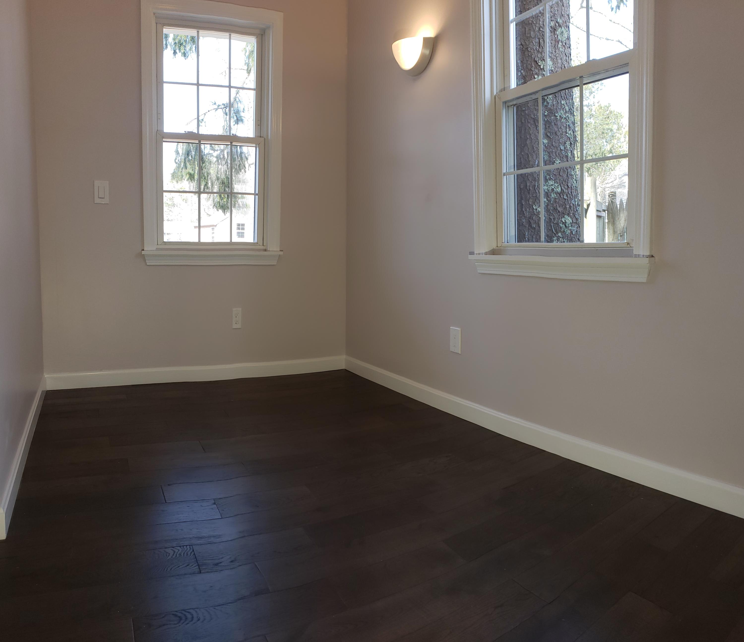 9 Bells Neck Road, Unit 3 West Harwich, MA 02671 - Photo 12 of 23 an empty room with wooden floor and windows