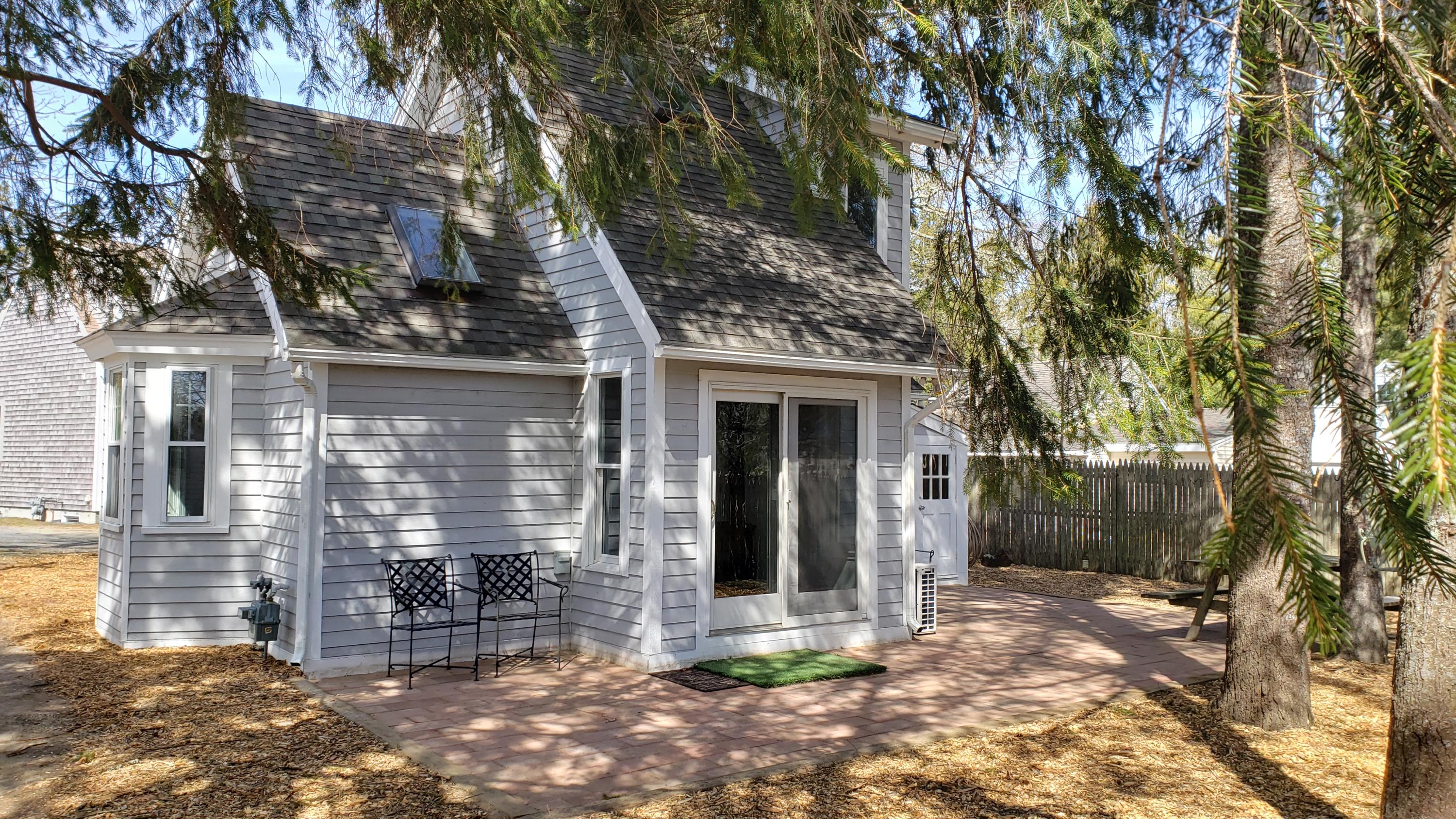 9 Bells Neck Road, Unit 3 West Harwich, MA 02671 - Photo 3 of 23 a front view of a house with yard