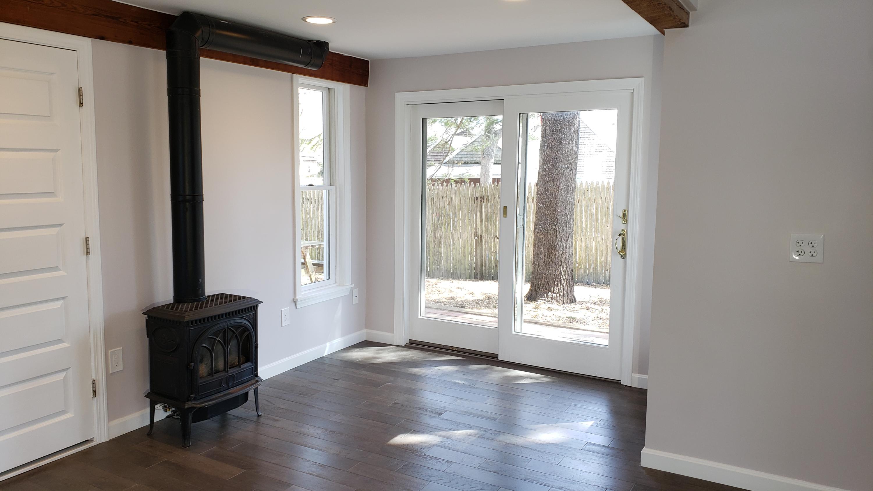 9 Bells Neck Road, Unit 3 West Harwich, MA 02671 - Photo 6 of 23 a view of a hallway with wooden floor and glass door