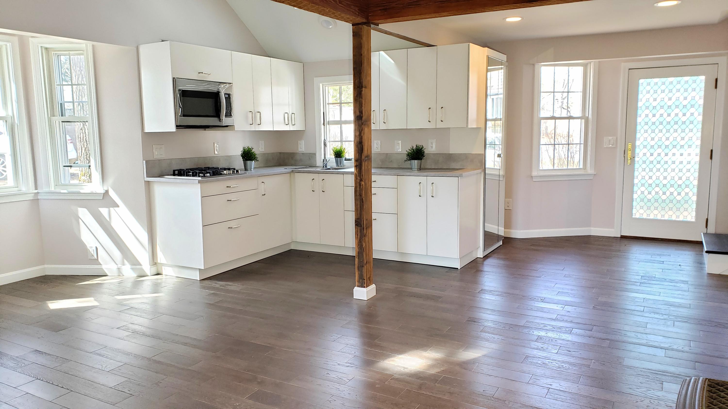 9 Bells Neck Road, Unit 3 West Harwich, MA 02671 - Photo 9 of 23 a kitchen with stainless steel appliances granite countertop a stove top oven a sink a counter space and cabinets