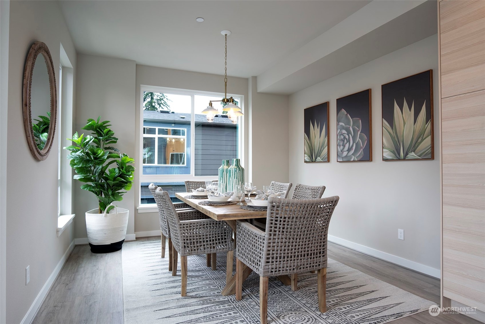 111 161st Place Southeast, Unit B7 Bothell, WA 98012 - Photo 17 of 40 a view of a dining room with furniture and chandelier