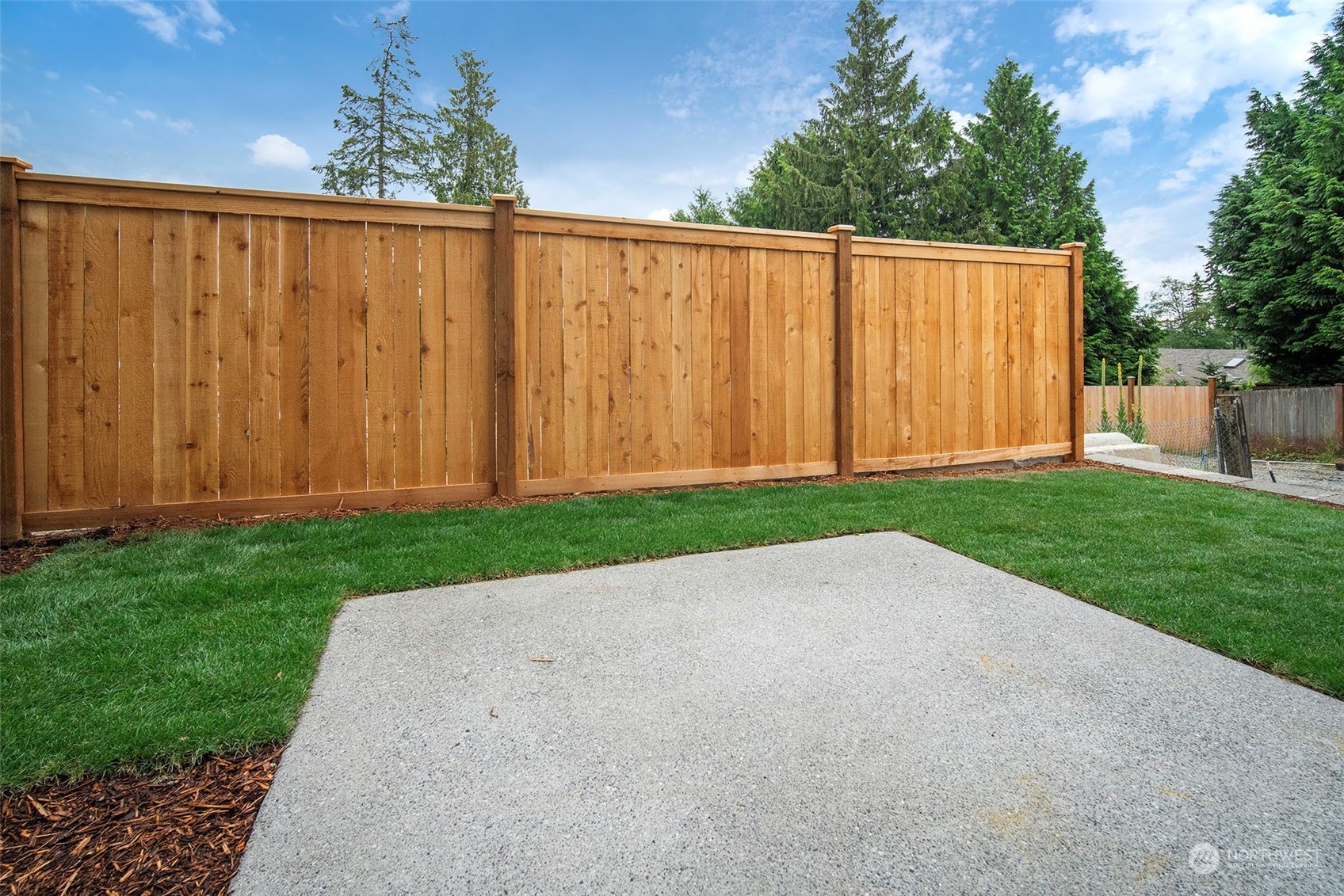 111 161st Place Southeast, Unit B7 Bothell, WA 98012 - Photo 38 of 40 a view of a backyard with wooden fence