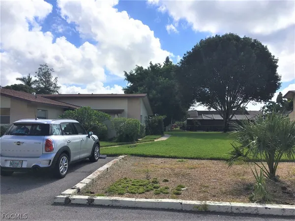 a backyard of a house with lots of green space
