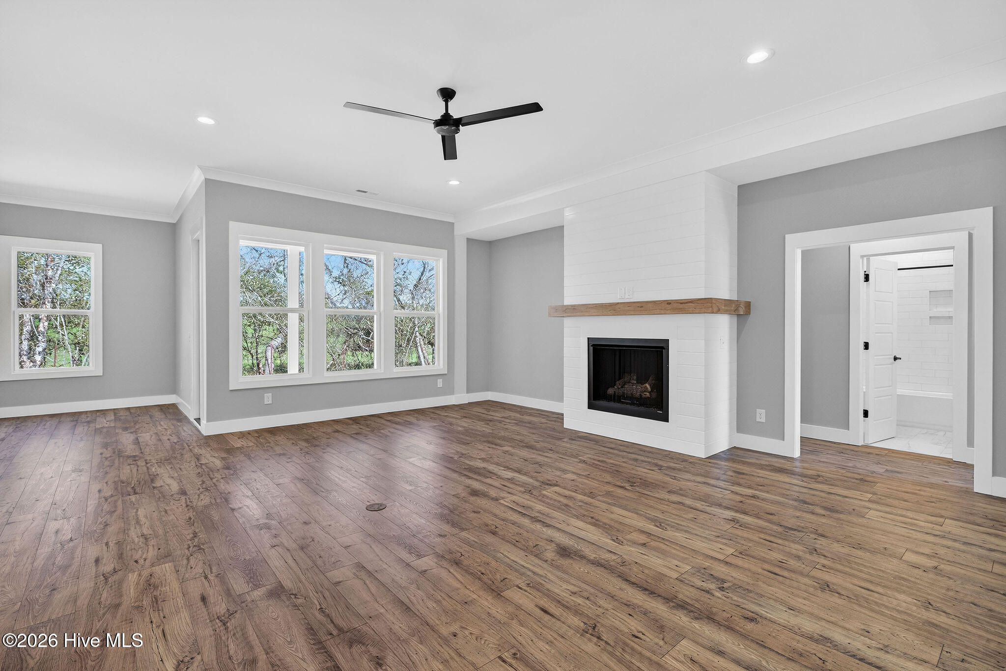 5988 Gray Squirrel Path Southport, NC 28461 - Photo 12 of 52 Living Room with Shiplap accented Gas Fireplace