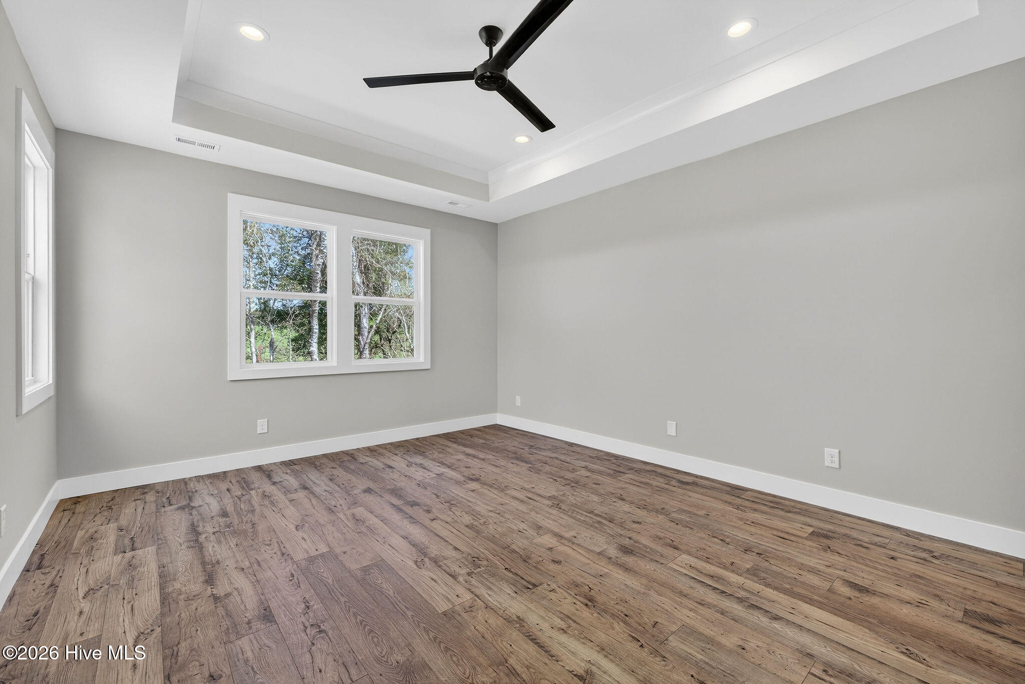 5988 Gray Squirrel Path Southport, NC 28461 - Photo 15 of 52 Spacious Primary Bedroom Suite with trayed ceiling