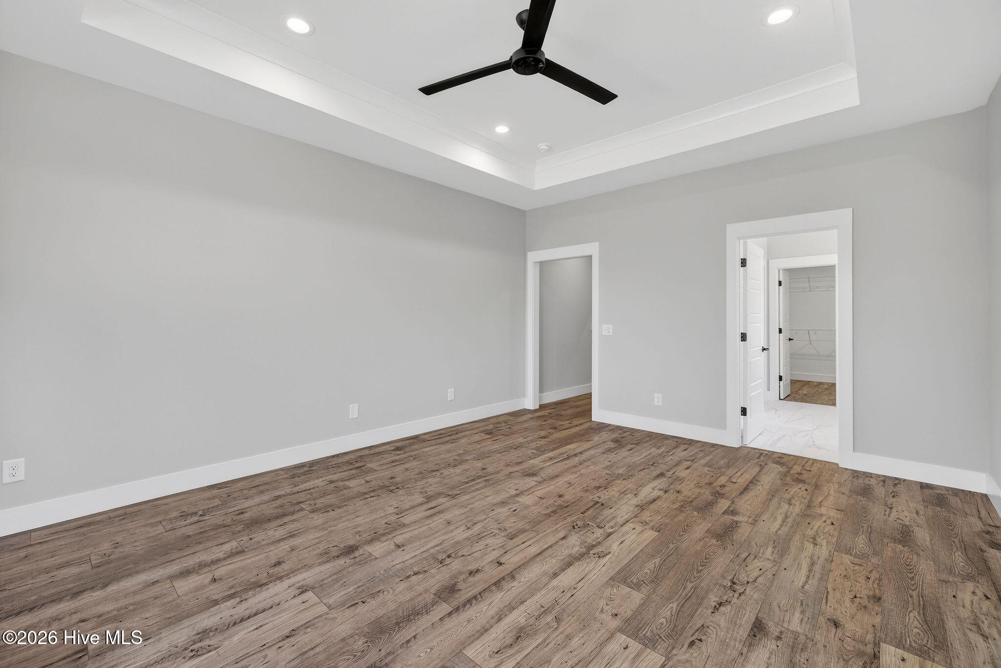 5988 Gray Squirrel Path Southport, NC 28461 - Photo 16 of 52 Spacious Primary Bedroom Suite with trayed ceiling