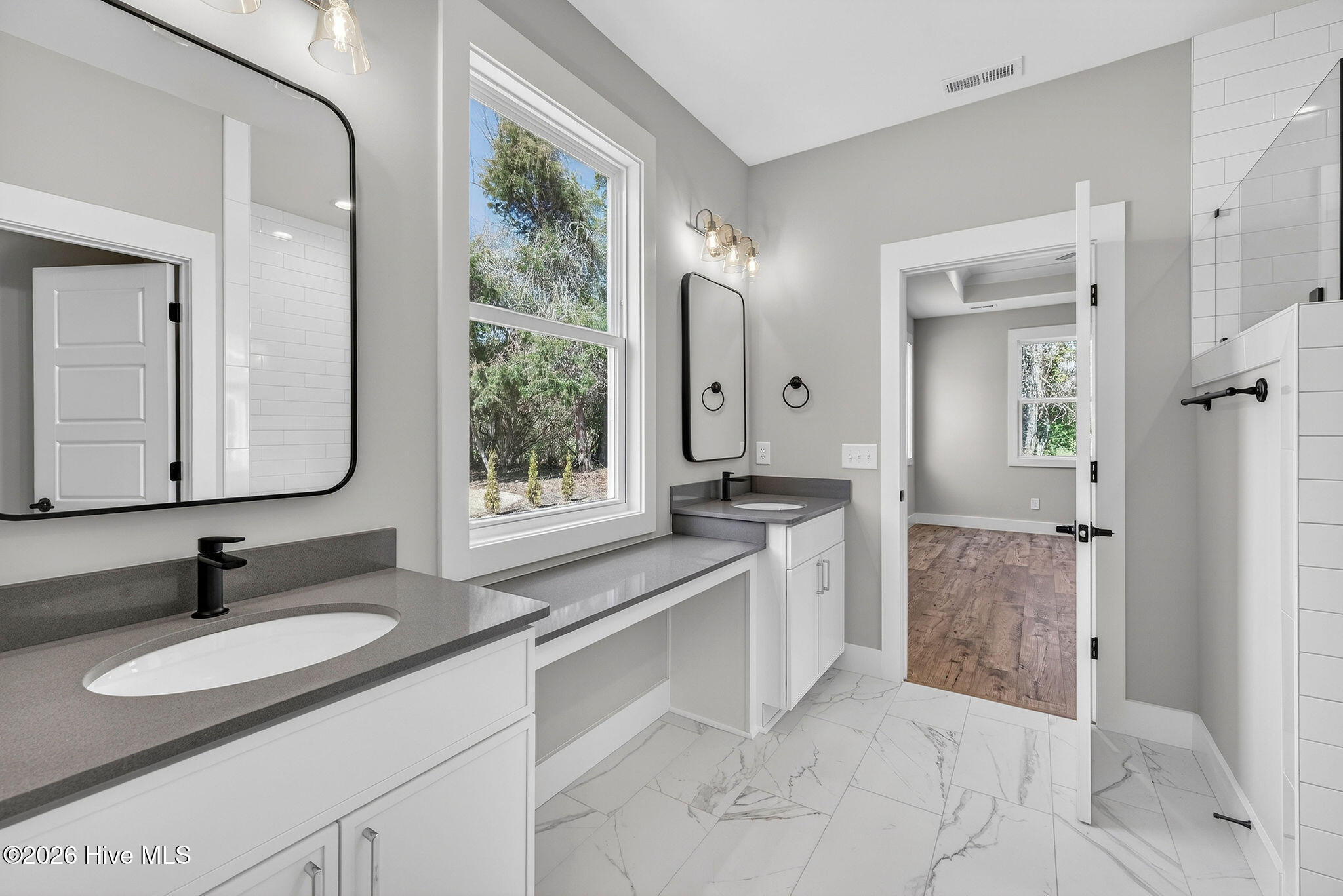 5988 Gray Squirrel Path Southport, NC 28461 - Photo 19 of 52 Primary Bathroom Suite with double vanities