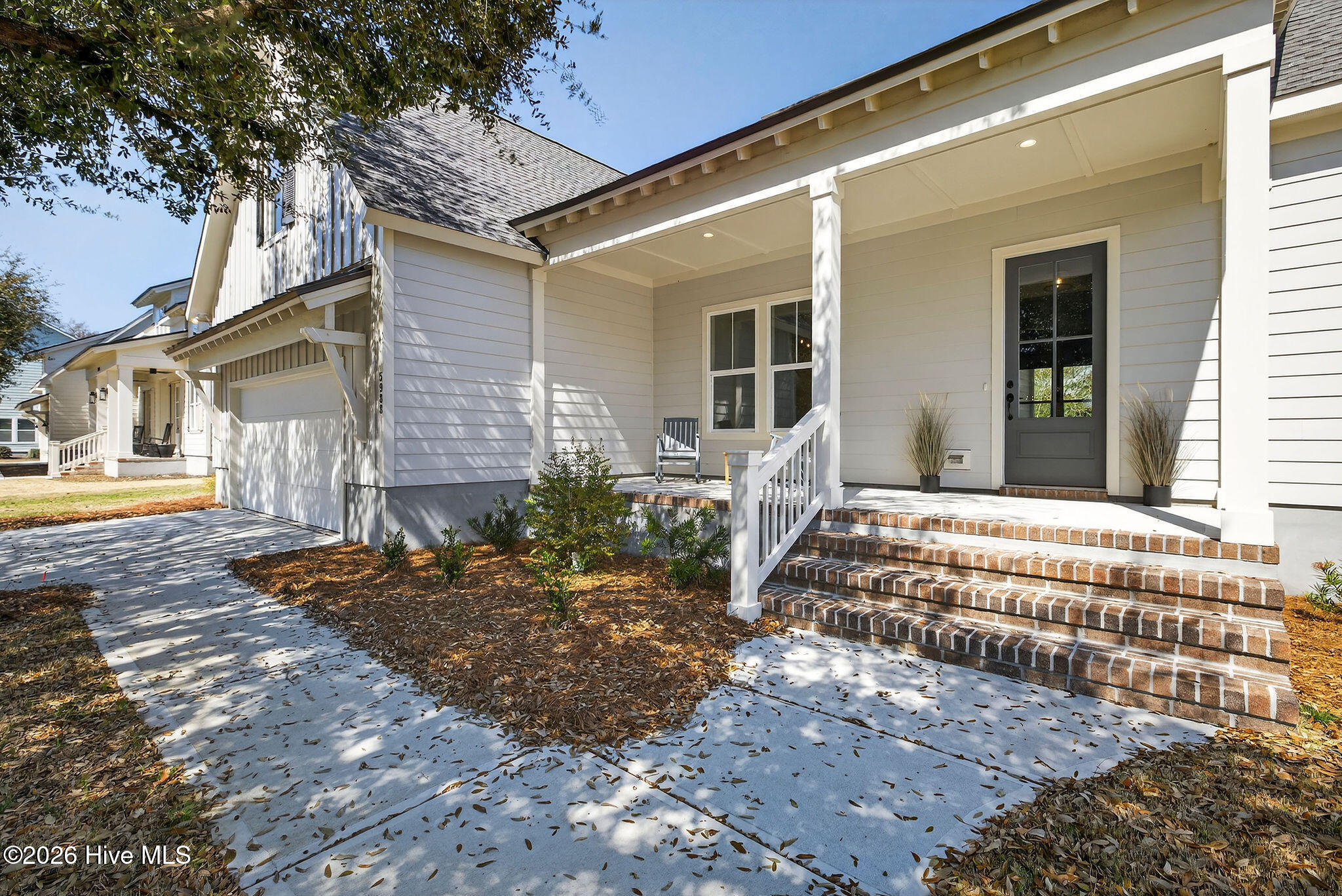 5988 Gray Squirrel Path Southport, NC 28461 - Photo 2 of 52 Welcoming front porch walkway