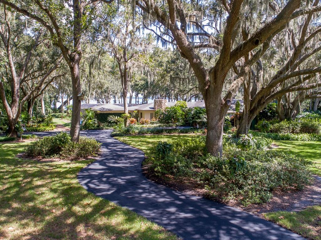 1224 Howard Road Leesburg, FL 34748 - Photo 1 of 1 Front of home set back with long paved driveway