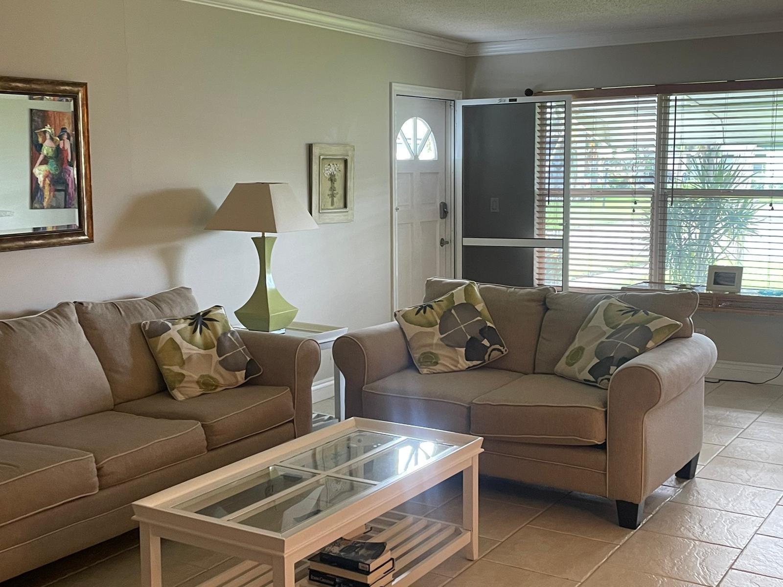 515 High Point, Unit C Delray Beach, FL 33445 - Photo 12 of 23 a living room with furniture and a window
