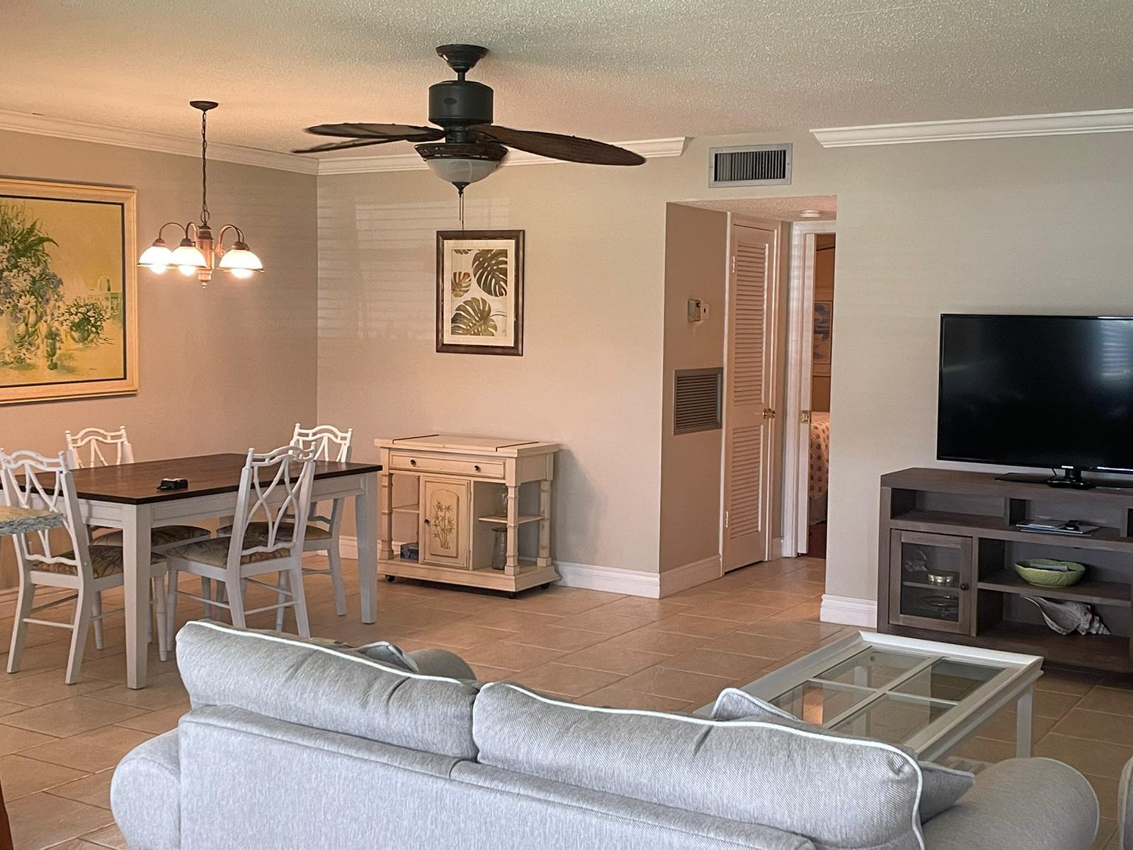 515 High Point, Unit C Delray Beach, FL 33445 - Photo 13 of 23 a living room with furniture and a flat screen tv