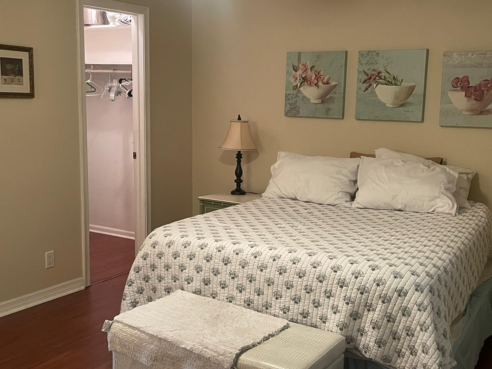 515 High Point, Unit C Delray Beach, FL 33445 - Photo 15 of 23 a bedroom with a bed and wall painting