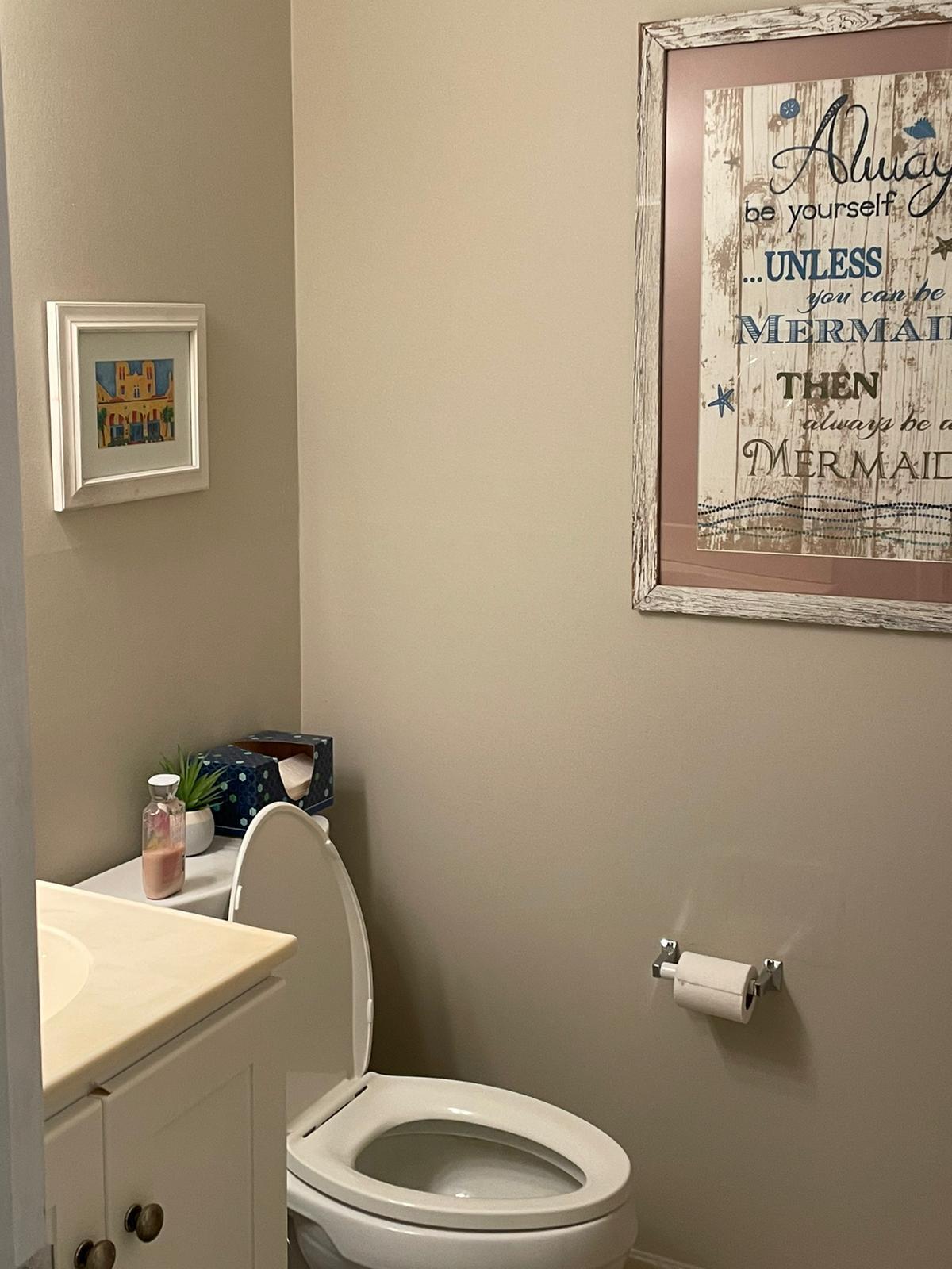 515 High Point, Unit C Delray Beach, FL 33445 - Photo 17 of 23 a white toilet sitting next to a bathroom sink