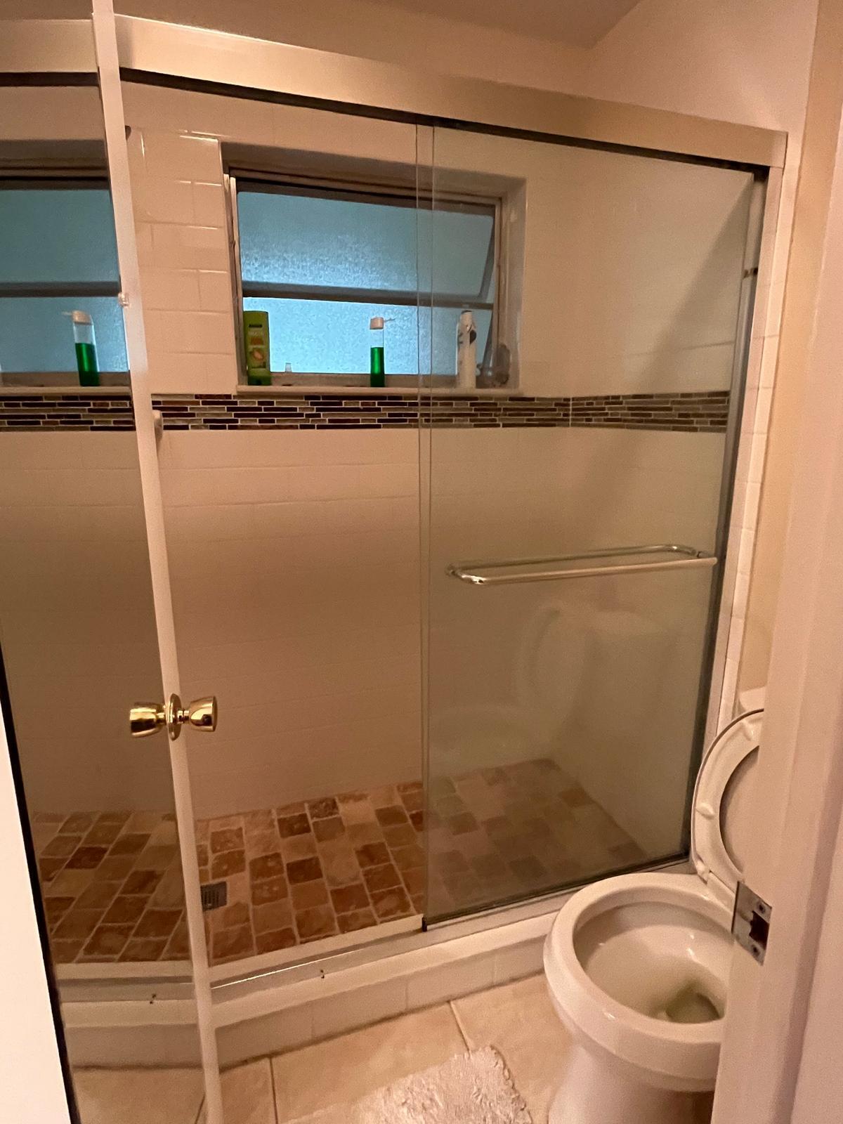 515 High Point, Unit C Delray Beach, FL 33445 - Photo 22 of 23 a bathroom with a toilet and a shower