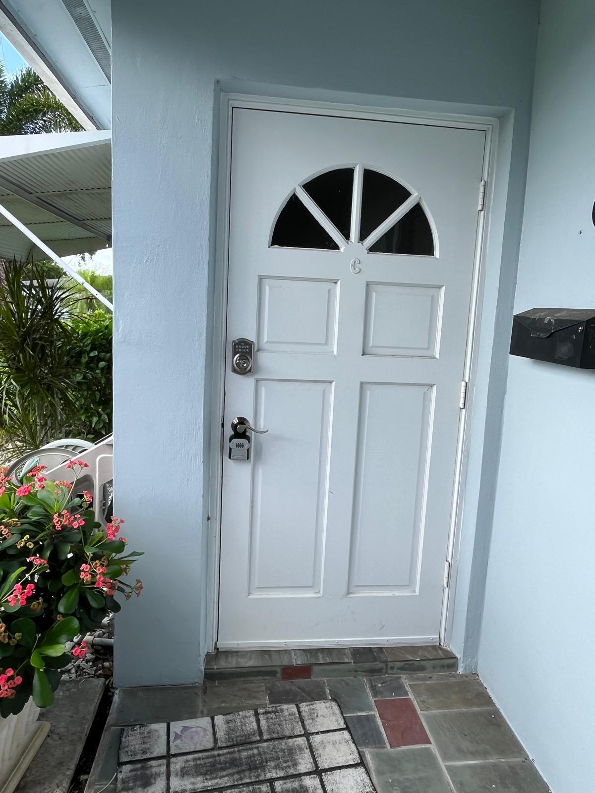 515 High Point, Unit C Delray Beach, FL 33445 - Photo 3 of 23 a view of a entryway door of the house