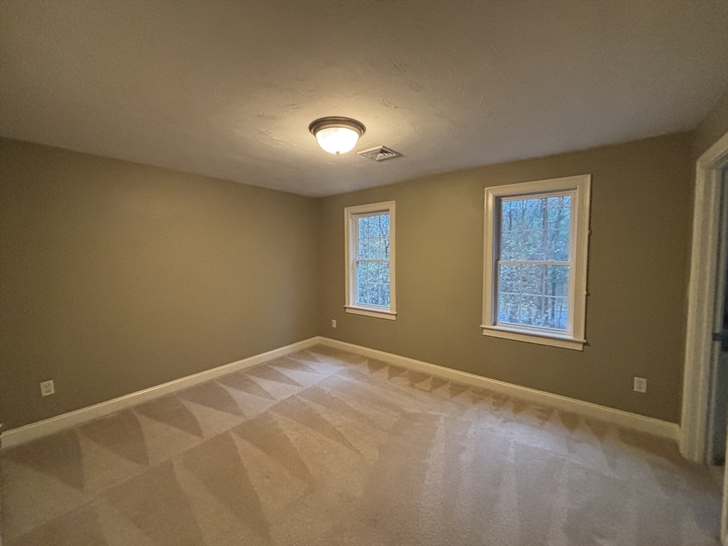 1 Tyler Road Upton, MA 01568 - Photo 7 of 12 a view of an empty room with windows