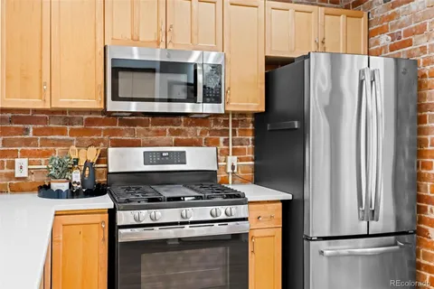 a view of kitchen with wooden floor