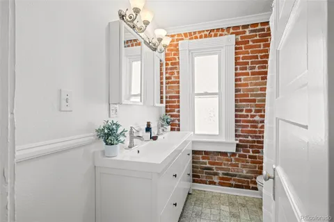 a bathroom with a white toilet and a sink