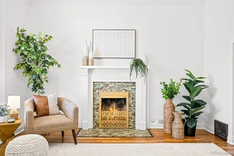 a living room with furniture and a chandelier