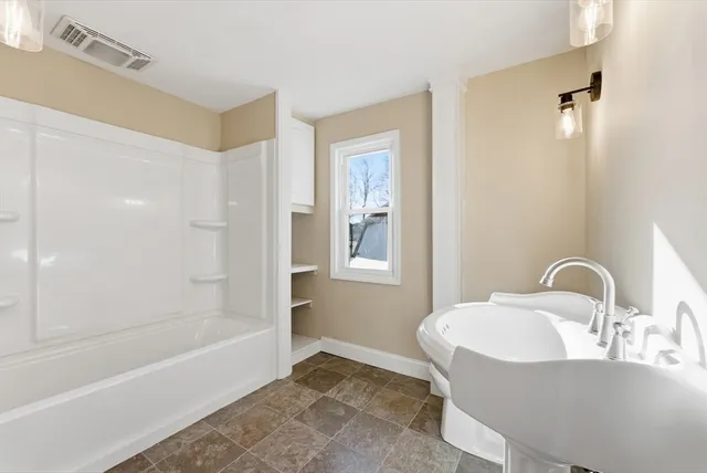 a bathroom with a sink and a bathtub