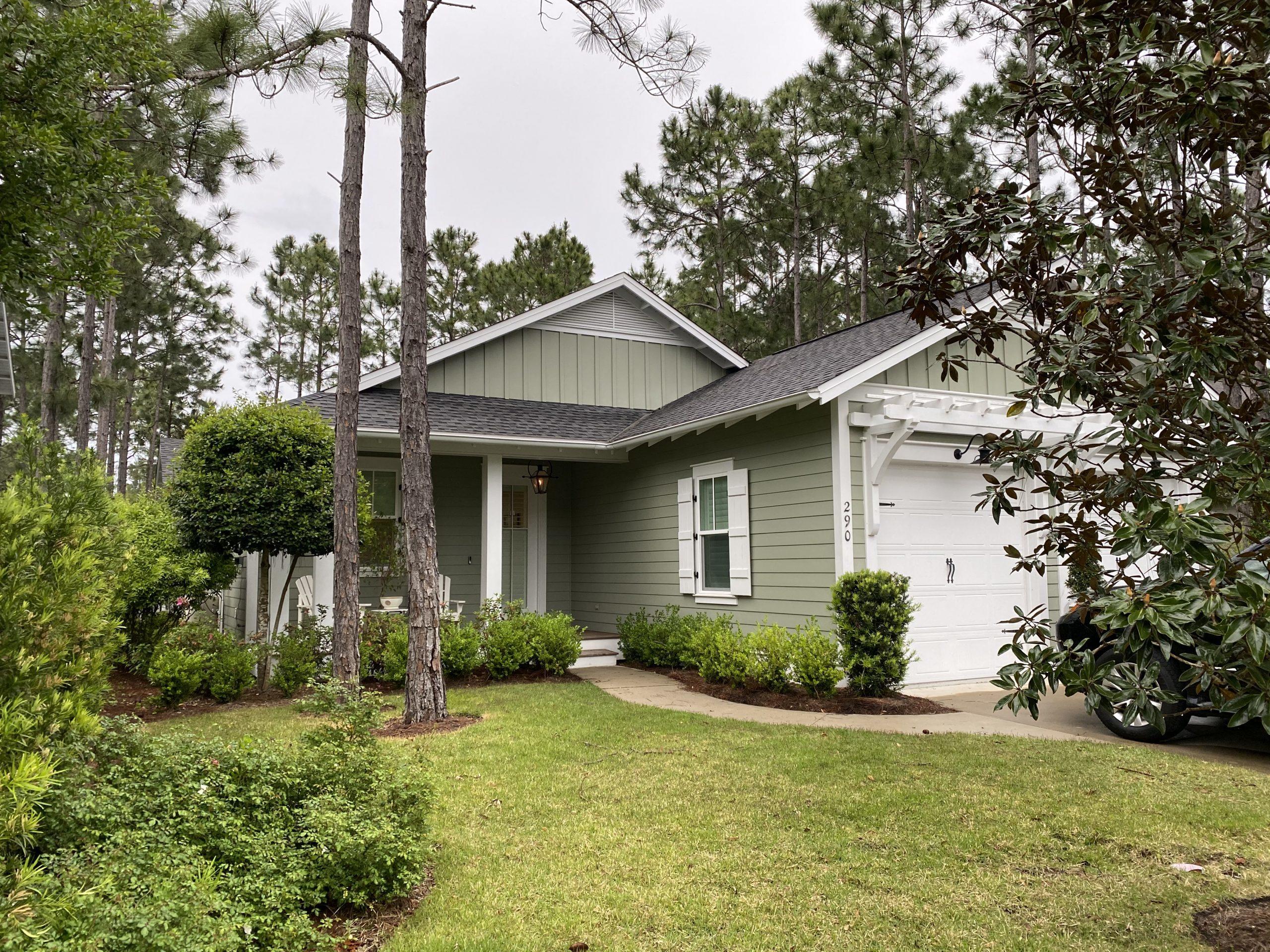 290 Jack Knife Drive Watersound, FL 32461 - Photo 1 of 40 a front view of a house with a yard and garage