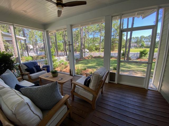 290 Jack Knife Drive Watersound, FL 32461 - Photo 16 of 40 a living room with furniture and a floor to ceiling window