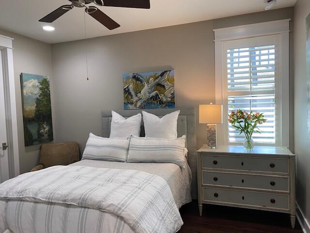 290 Jack Knife Drive Watersound, FL 32461 - Photo 19 of 40 a bedroom with a bed and a potted plant