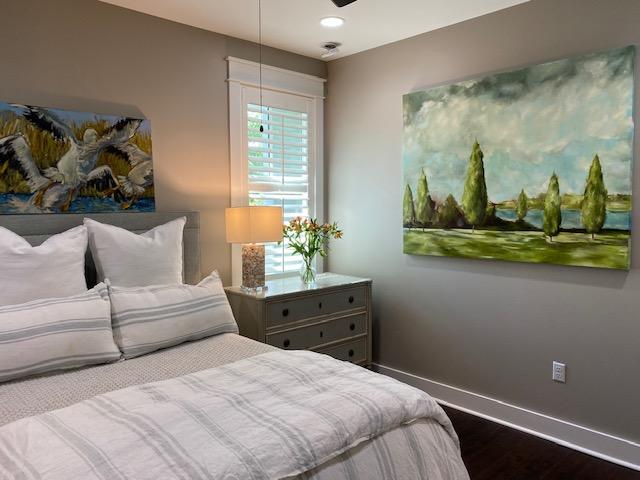 290 Jack Knife Drive Watersound, FL 32461 - Photo 20 of 40 a bedroom with a bed and wooden floor