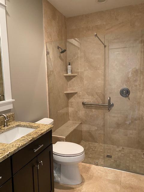 290 Jack Knife Drive Watersound, FL 32461 - Photo 21 of 40 a bathroom with a granite countertop sink toilet and shower