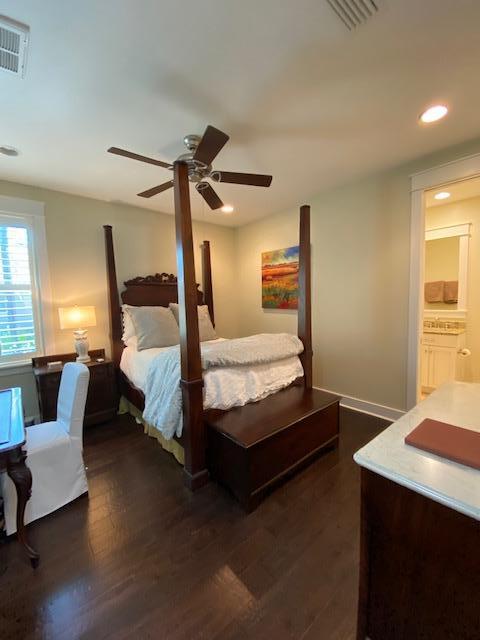 290 Jack Knife Drive Watersound, FL 32461 - Photo 22 of 40 a bedroom with a bed and wooden floor