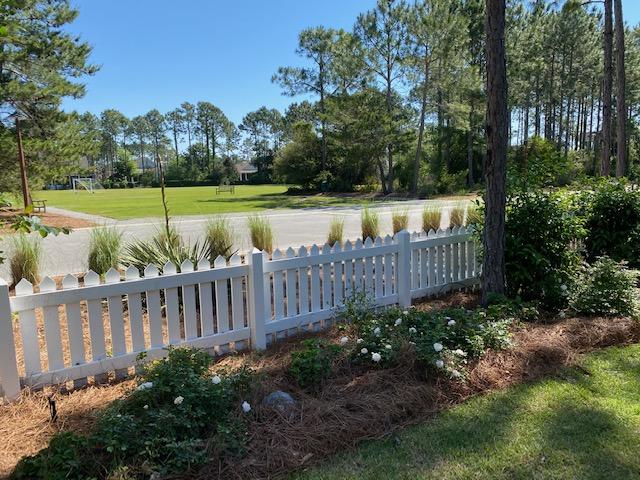 290 Jack Knife Drive Watersound, FL 32461 - Photo 26 of 40 a view of a garden with wooden fence