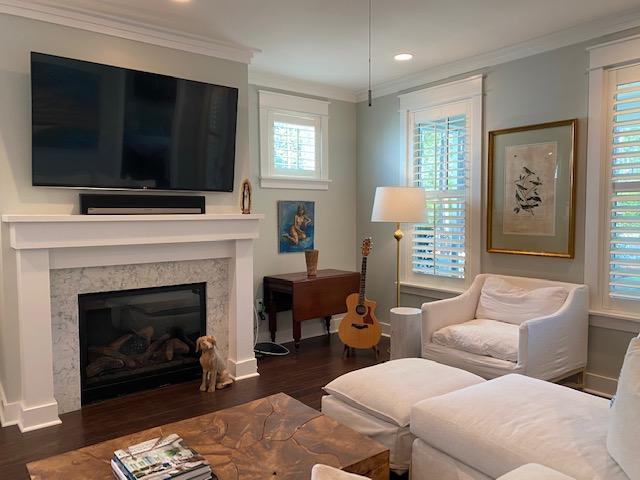 290 Jack Knife Drive Watersound, FL 32461 - Photo 5 of 40 a living room with furniture a flat screen tv and a fireplace