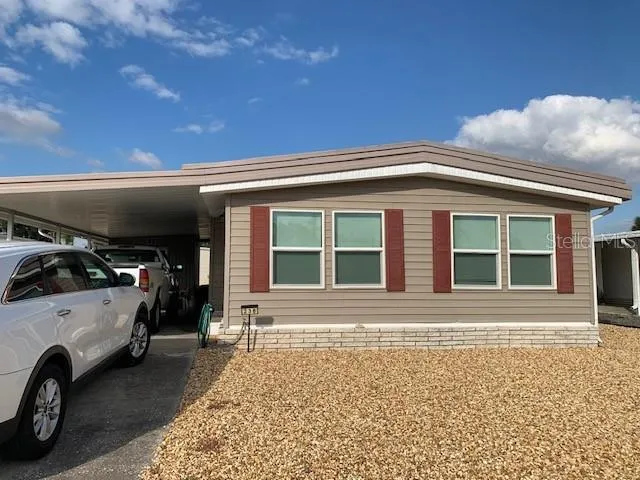 a view of a car parked in front of a house