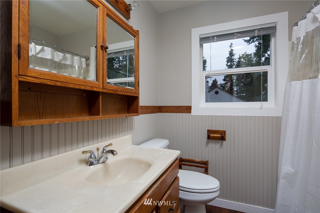 209 Parkridge Road Bellingham, WA 98225 - Photo 18 of 33 a bathroom with a sink a mirror and a toilet
