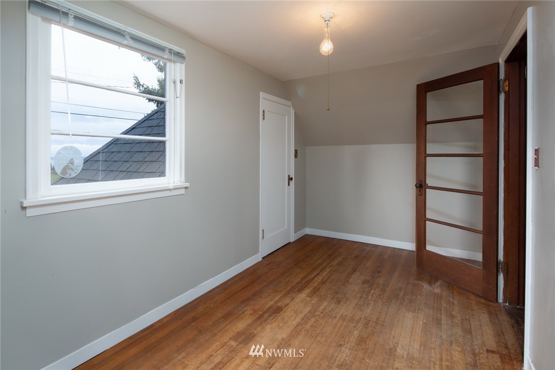 209 Parkridge Road Bellingham, WA 98225 - Photo 23 of 33 an empty room with wooden floor closet and windows