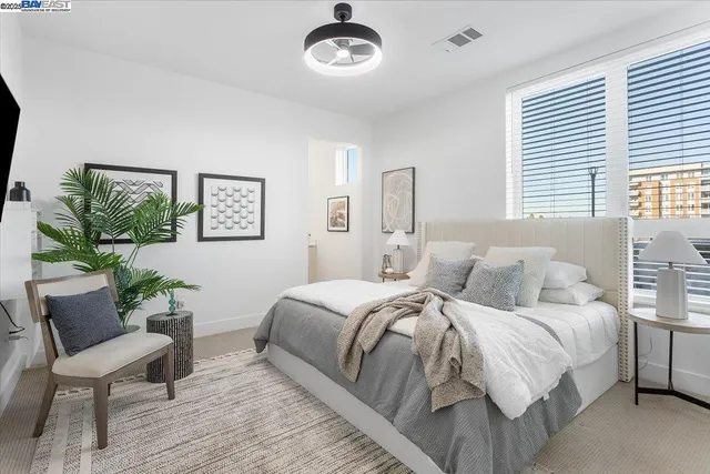 a bedroom with a bed and a window