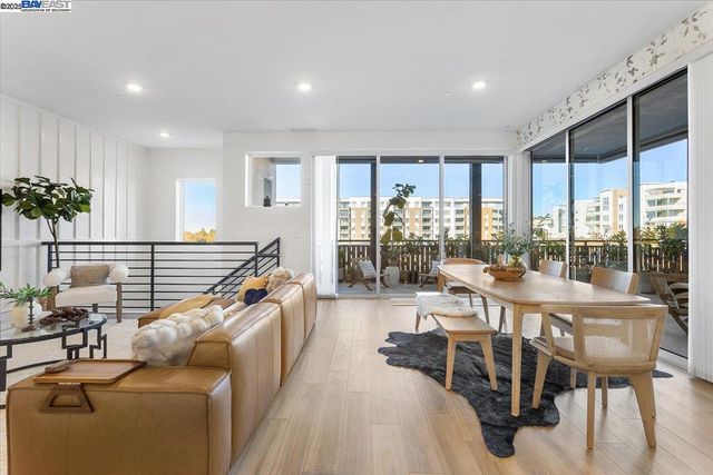 a view of a living room and dining room