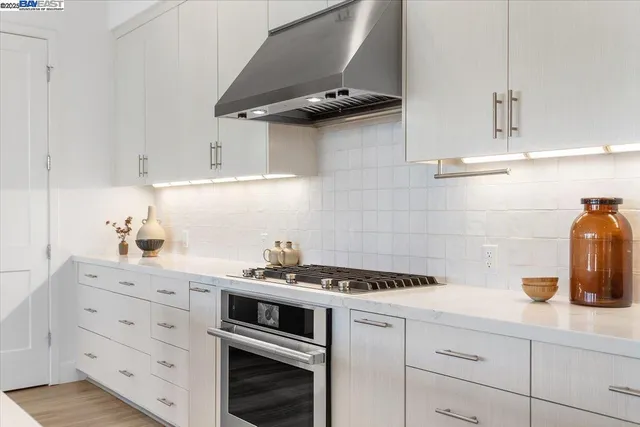 a kitchen with a sink and a refrigerator