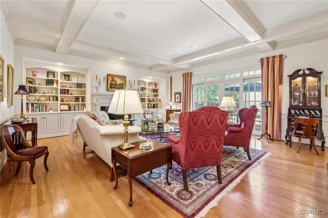 a living room with furniture window and wooden floor