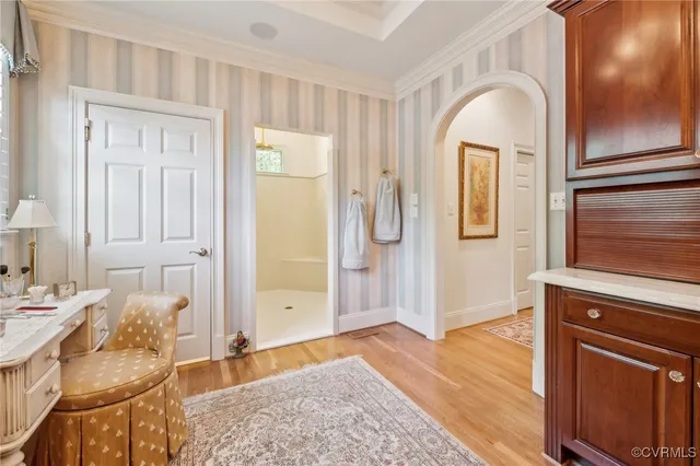 a spacious bedroom with a bed and a couch